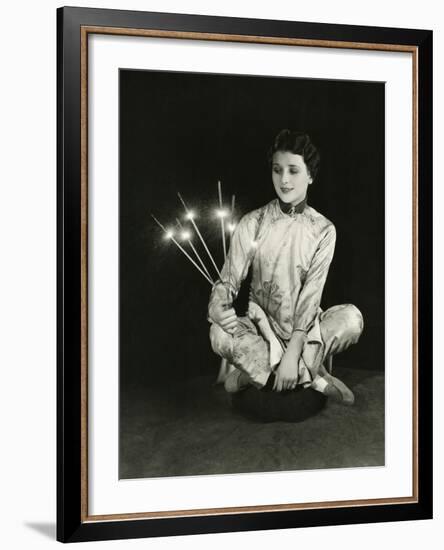 A Woman Holds Sparklers-null-Framed Photo