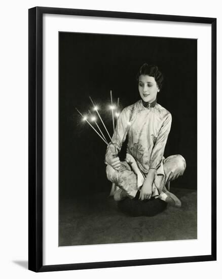 A Woman Holds Sparklers-null-Framed Photo