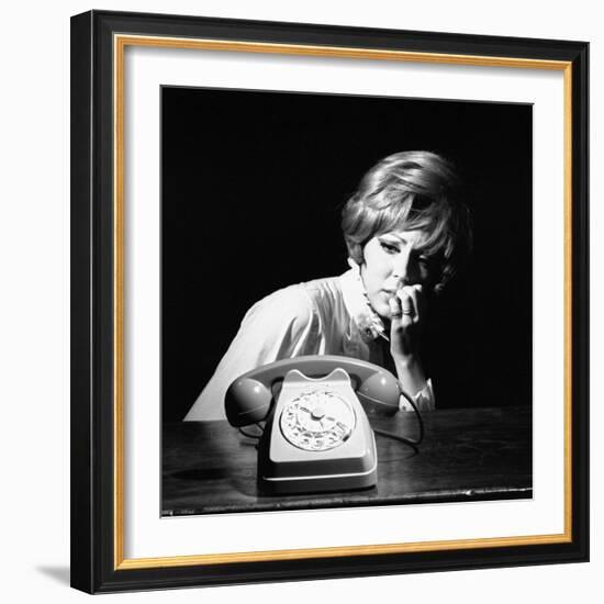 A Woman Looking at a Phone-Marisa Rastellini-Framed Photographic Print