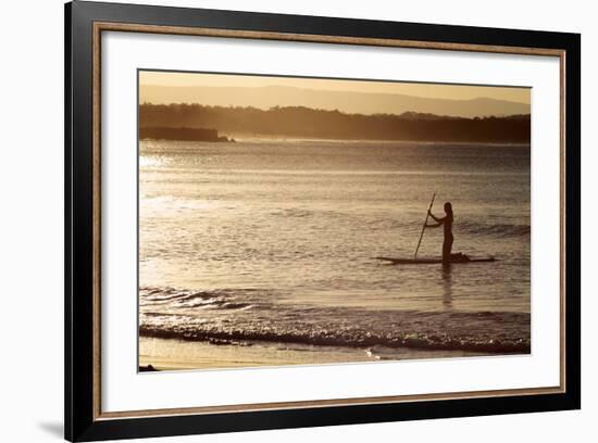 A Woman on a Stand-Up Paddleboard Heads Towards Main Beach, Noosa, at Sunset-William Gray-Framed Photographic Print