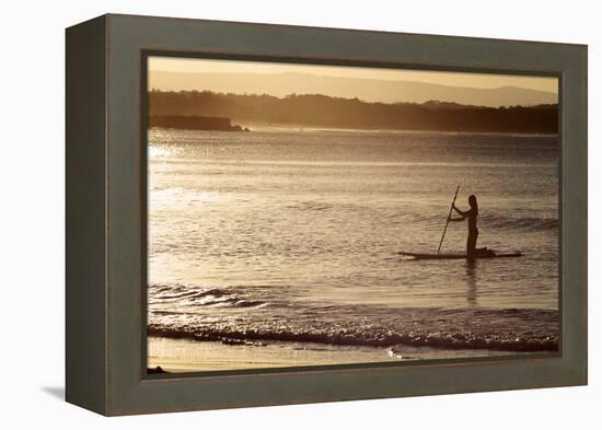 A Woman on a Stand-Up Paddleboard Heads Towards Main Beach, Noosa, at Sunset-William Gray-Framed Premier Image Canvas