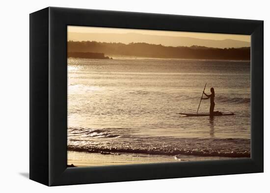 A Woman on a Stand-Up Paddleboard Heads Towards Main Beach, Noosa, at Sunset-William Gray-Framed Premier Image Canvas