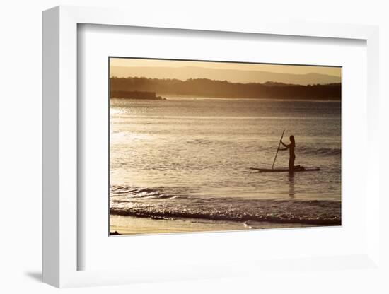 A Woman on a Stand-Up Paddleboard Heads Towards Main Beach, Noosa, at Sunset-William Gray-Framed Photographic Print