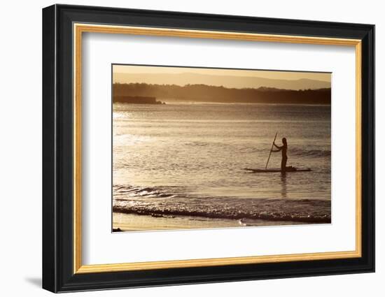 A Woman on a Stand-Up Paddleboard Heads Towards Main Beach, Noosa, at Sunset-William Gray-Framed Photographic Print