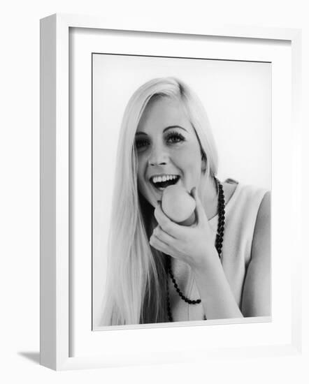 A Woman Poses Holding an Apple Up to Her Mouth-null-Framed Photographic Print