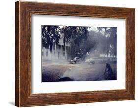 A Woman Rakes and Burns Brush in Front of a Church on Edisto Island, South Carolina, 1956-Walter Sanders-Framed Photographic Print