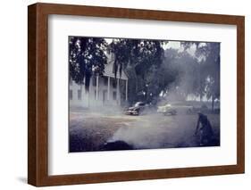 A Woman Rakes and Burns Brush in Front of a Church on Edisto Island, South Carolina, 1956-Walter Sanders-Framed Photographic Print