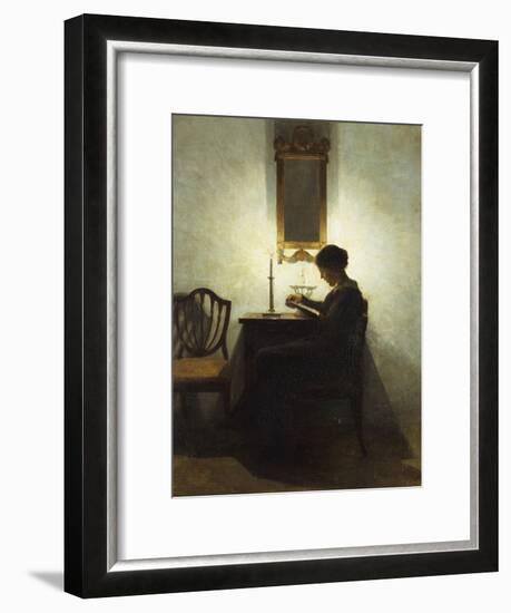 A Woman Reading by Candlelight in an Interior-Peter Ilsted-Framed Giclee Print