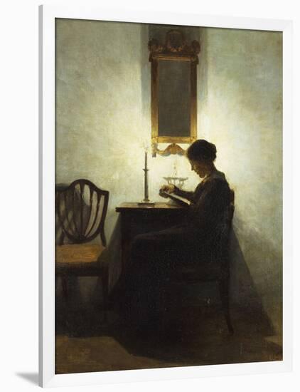 A Woman Reading by Candlelight in an Interior-Peter Ilsted-Framed Giclee Print