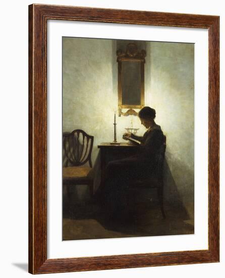 A Woman Reading by Candlelight in an Interior-Peter Ilsted-Framed Giclee Print