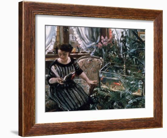 A Woman Reading Near a Goldfish Tank-Lovis Corinth-Framed Giclee Print