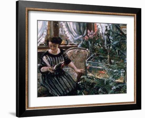 A Woman Reading Near a Goldfish Tank-Lovis Corinth-Framed Giclee Print