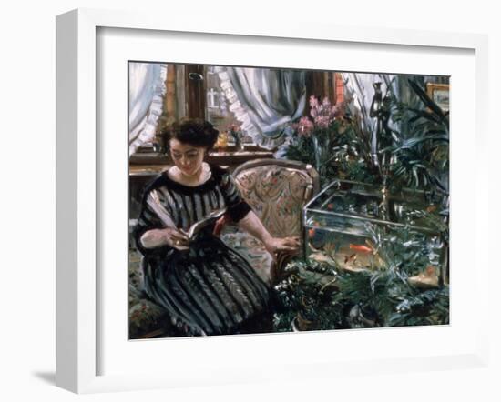 A Woman Reading Near a Goldfish Tank-Lovis Corinth-Framed Giclee Print