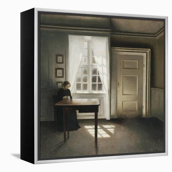 A Woman Sewing in an Interior-Vilhelm Hammershoi-Framed Premier Image Canvas