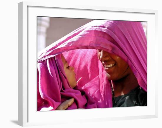 A Woman Shields Her Child from the Sun Using Her Scarf-null-Framed Photographic Print