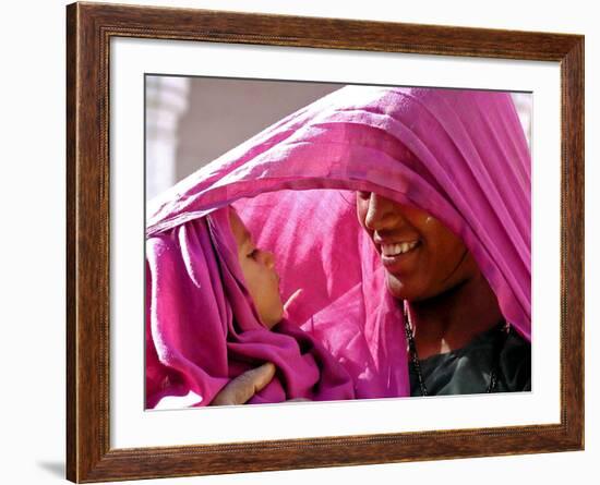 A Woman Shields Her Child from the Sun Using Her Scarf-null-Framed Photographic Print