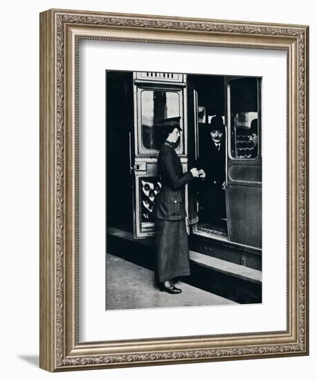 A woman ticket inspector at work, c1914-Unknown-Framed Photographic Print