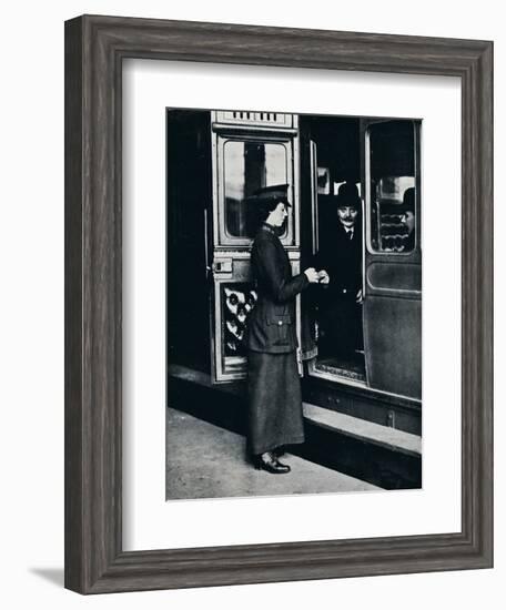 A woman ticket inspector at work, c1914-Unknown-Framed Photographic Print