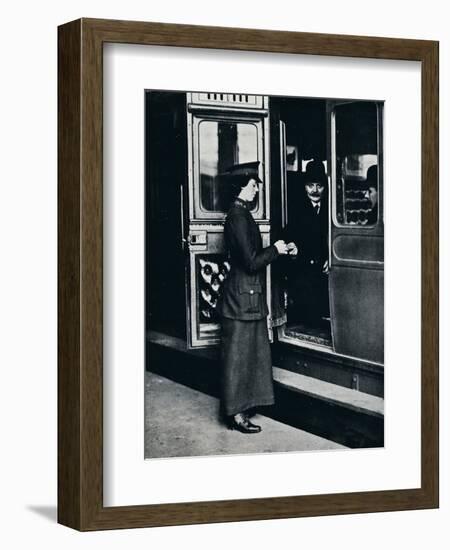 A woman ticket inspector at work, c1914-Unknown-Framed Photographic Print