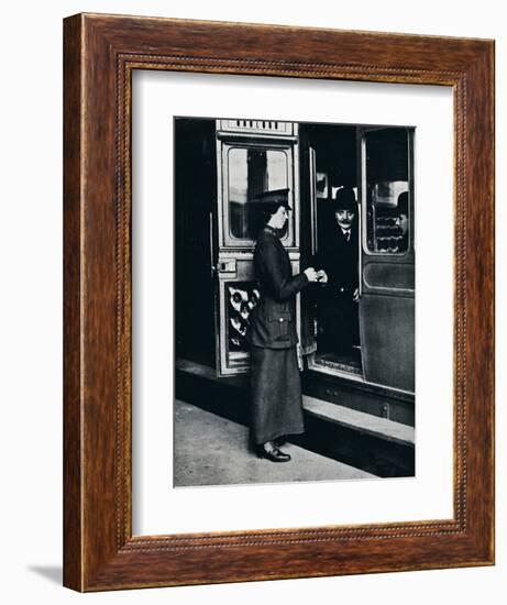 A woman ticket inspector at work, c1914-Unknown-Framed Photographic Print