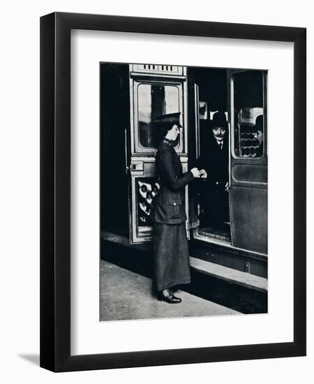 A woman ticket inspector at work, c1914-Unknown-Framed Photographic Print