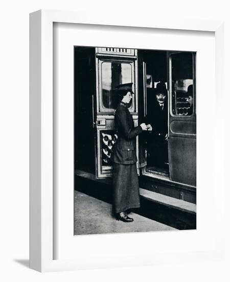 A woman ticket inspector at work, c1914-Unknown-Framed Photographic Print