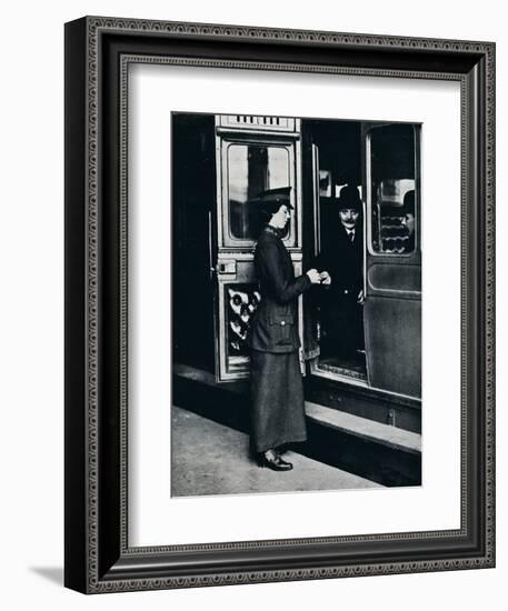 A woman ticket inspector at work, c1914-Unknown-Framed Photographic Print