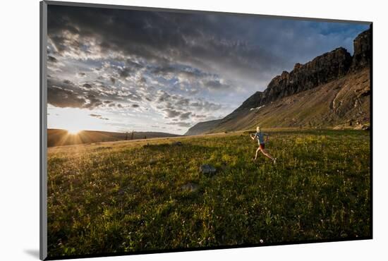 A Woman Trail Running in Glacier National Park, Montana-Steven Gnam-Mounted Photographic Print