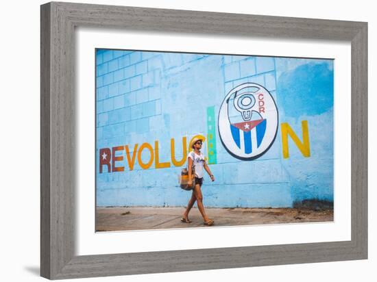 A Woman Walks Past A Propagandistic Mural In Cienfuegos, Cuba-Erik Kruthoff-Framed Photographic Print