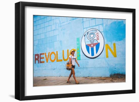 A Woman Walks Past A Propagandistic Mural In Cienfuegos, Cuba-Erik Kruthoff-Framed Photographic Print