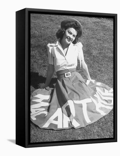 A Woman Wearing a Skirt That Says "Macarthur" in Honor of General Douglas Macarthur-null-Framed Premier Image Canvas