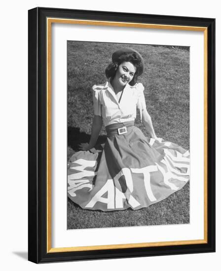 A Woman Wearing a Skirt That Says "Macarthur" in Honor of General Douglas Macarthur-null-Framed Photographic Print