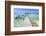 A Wood Pier Leads to Moored Boats and Clear Tropical Waters Near Staniel Cay, Exuma, Bahamas-James White-Framed Photographic Print