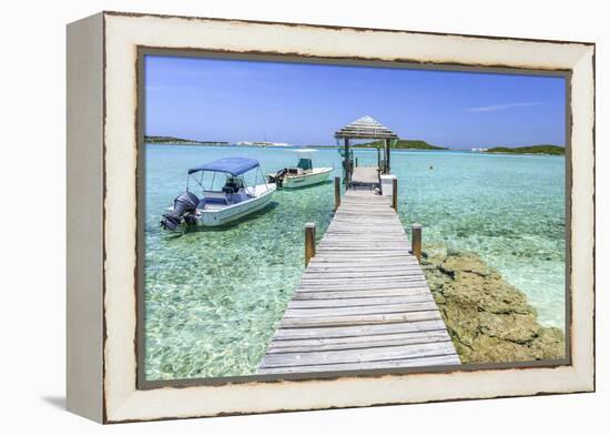 A Wood Pier Leads to Moored Boats and Clear Tropical Waters Near Staniel Cay, Exuma, Bahamas-James White-Framed Premier Image Canvas