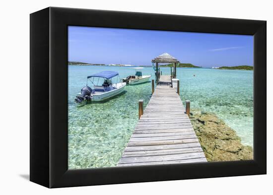 A Wood Pier Leads to Moored Boats and Clear Tropical Waters Near Staniel Cay, Exuma, Bahamas-James White-Framed Premier Image Canvas