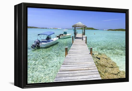 A Wood Pier Leads to Moored Boats and Clear Tropical Waters Near Staniel Cay, Exuma, Bahamas-James White-Framed Premier Image Canvas