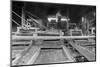 A Worker Stands over a Rock or Gravel Processing Facility, Ca. 1910-null-Mounted Photographic Print