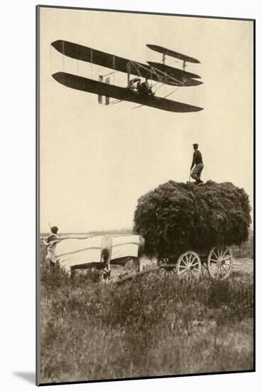 A Wright Airplane over a Hayfield in France, 1908, Flown by Wilbur Wright and a Pupil-null-Mounted Giclee Print