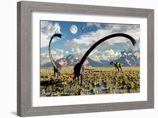 A Yangchuanosaurus Dinosaur Stalking an Omeisaurus-null-Framed Art Print