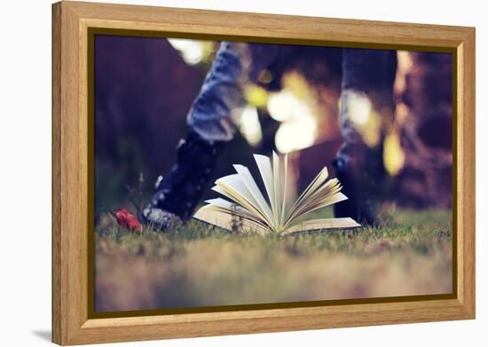 A Young Adult Standing over an Open Book-Carolina Hernández-Framed Premier Image Canvas