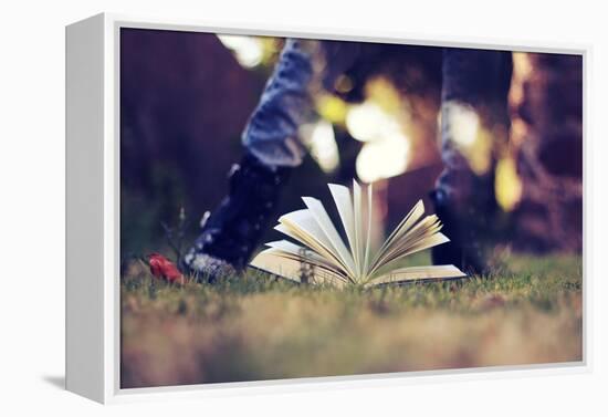 A Young Adult Standing over an Open Book-Carolina Hernández-Framed Premier Image Canvas