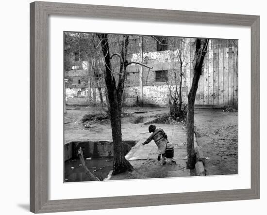 A Young Afghan Girl Carries Water from a Well to Her Family-null-Framed Photographic Print