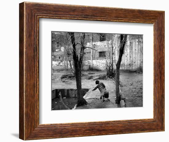 A Young Afghan Girl Carries Water from a Well to Her Family-null-Framed Photographic Print