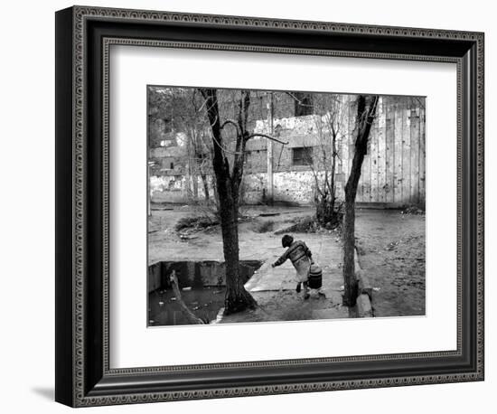 A Young Afghan Girl Carries Water from a Well to Her Family-null-Framed Photographic Print