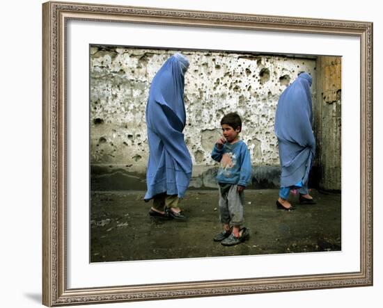 A Young Afghan Refugee Boy Stands in a Pair of Adult's Shoes-null-Framed Photographic Print