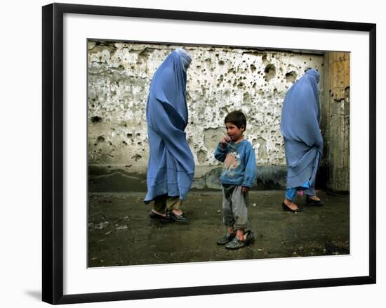 A Young Afghan Refugee Boy Stands in a Pair of Adult's Shoes-null-Framed Photographic Print