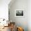 A Young Afghan Refugee Boy Stands in a Pair of Adult's Shoes-null-Framed Photographic Print displayed on a wall