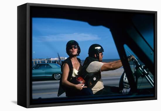 A Young Biker Sitting on the Motorbike Saddle with His Companion-Mario de Biasi-Framed Premier Image Canvas