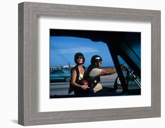 A Young Biker Sitting on the Motorbike Saddle with His Companion-Mario de Biasi-Framed Photographic Print