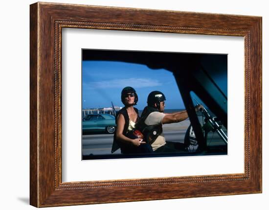 A Young Biker Sitting on the Motorbike Saddle with His Companion-Mario de Biasi-Framed Photographic Print